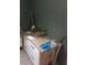 Bedroom with light-colored dresser featuring drawers and a built-in wooden countertop at 2822 S Dean Rd, Orlando, FL 32825