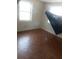 Bedroom featuring parquet wood floors and natural light from two windows at 2822 S Dean Rd, Orlando, FL 32825