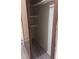 Empty closet with wooden trim, upper shelving, and light-colored walls at 2822 S Dean Rd, Orlando, FL 32825