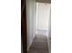 This hallway features light walls and laminate wood-style flooring at 2822 S Dean Rd, Orlando, FL 32825