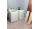 Laundry room with white washer and dryer at 2822 S Dean Rd, Orlando, FL 32825