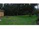 Green backyard with mature trees and minimal landscaping at 2913 Deerbrook Dr, Lakeland, FL 33811