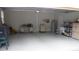 Spacious garage with painted walls, concrete floor and storage at 2913 Deerbrook Dr, Lakeland, FL 33811