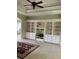Bright living room with custom built-in shelving and cabinets, and decorative area rug at 2913 Deerbrook Dr, Lakeland, FL 33811