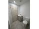 Bathroom with gray vanity, and tile flooring, next to toilet under construction at 2921 Crutchfield W Rd, Lakeland, FL 33805