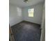 Comfortable bedroom featuring neutral carpet, with a bright window at 2921 Crutchfield W Rd, Lakeland, FL 33805