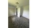 Bright bedroom featuring soft gray carpeting, and a spacious closet for storage at 2921 Crutchfield W Rd, Lakeland, FL 33805
