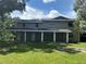 Large, two-story home with ample backyard and covered back patio at 2921 Crutchfield W Rd, Lakeland, FL 33805