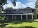Large, two-story home with ample backyard and covered back patio at 2921 Crutchfield W Rd, Lakeland, FL 33805