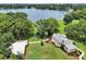 Expansive property with a beautiful home, lush greenery, and stunning lake views, ideal for outdoor living at 3450 Ohio Ave, Sanford, FL 32773