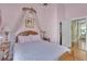 The bedroom features a hardwood floor, canopy bed, and bright walls at 3450 Ohio Ave, Sanford, FL 32773