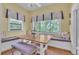 Charming dining nook with built-in seating, large windows, and a wooden table creating a cozy atmosphere at 3450 Ohio Ave, Sanford, FL 32773
