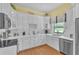 Modern kitchen featuring white cabinets, stainless steel appliances, and ample counter space for cooking and entertaining at 3450 Ohio Ave, Sanford, FL 32773