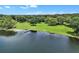 Tranquil lakefront property with a private dock and manicured lawn at 3450 Ohio Ave, Sanford, FL 32773