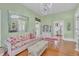 Charming living room with a crystal chandelier, stylish decor, and hardwood floors creating a cozy atmosphere at 3450 Ohio Ave, Sanford, FL 32773