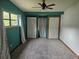Spacious bedroom with ceiling fan, two closets, and bright window at 360 Kentia Rd, Casselberry, FL 32707