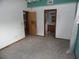 Bedroom with neutral carpet, a view of the attached bathroom, and good natural light at 360 Kentia Rd, Casselberry, FL 32707