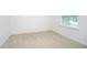 Well-lit bedroom with carpeted floor and a window with blinds at 3850 Hampstead Ln, Lakeland, FL 33810