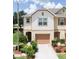 Charming two-story townhome featuring a well-maintained lawn and attached one car garage at 3850 Hampstead Ln, Lakeland, FL 33810
