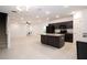 Open floorplan featuring kitchen, island and dining area with modern black appliances and granite countertops at 3850 Hampstead Ln, Lakeland, FL 33810