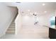 Bright living area with a ceiling fan and staircase at 3850 Hampstead Ln, Lakeland, FL 33810