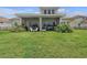 Spacious backyard and covered patio for outdoor dining at 3869 Shoreside Dr, Kissimmee, FL 34746