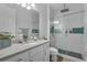 Bathroom with a glass-enclosed shower, marble countertop, and updated fixtures at 3869 Shoreside Dr, Kissimmee, FL 34746
