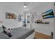 ' bedroom offers unique decor including drawings and a ceiling fan with bright natural light at 3869 Shoreside Dr, Kissimmee, FL 34746