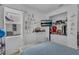 Bedroom with playful wall decorations, closet, and comfortable sleeping area at 3869 Shoreside Dr, Kissimmee, FL 34746