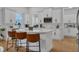 Bright kitchen with sleek white cabinets, quartz countertops, and stainless steel appliances at 3869 Shoreside Dr, Kissimmee, FL 34746