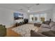 Spacious living room with a large TV, comfortable seating, and lots of natural light at 3869 Shoreside Dr, Kissimmee, FL 34746