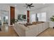 A spacious living room features a large sectional, a textured wall, and large windows at 3869 Shoreside Dr, Kissimmee, FL 34746