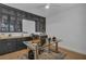 Office with sleek black cabinetry, glass-top desk, and a comfortable workspace at 3869 Shoreside Dr, Kissimmee, FL 34746
