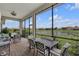 Covered patio with comfortable seating, perfect for enjoying the outdoor view at 3869 Shoreside Dr, Kissimmee, FL 34746