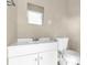 Clean bathroom featuring a bright vanity, contemporary faucet and toilet at 5390 Botany Ct, Orlando, FL 32811
