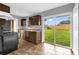 Updated kitchen features granite countertops, stainless steel appliances and sliding glass doors at 5390 Botany Ct, Orlando, FL 32811