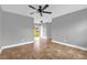 This light and bright living room features a sliding glass door at 5390 Botany Ct, Orlando, FL 32811