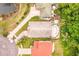 Aerial view of a single Gathering home featuring a swimming pool and well manicured landscaping at 615 Maple Forest Dr, Orlando, FL 32825
