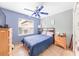 Comfortable bedroom with tile floors, a ceiling fan, and natural light at 615 Maple Forest Dr, Orlando, FL 32825