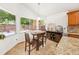 Bright breakfast nook featuring a table, chairs, and a view of the green outdoors at 615 Maple Forest Dr, Orlando, FL 32825
