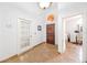 Bright entryway featuring tile floors, a front door, and a doorway to another room at 615 Maple Forest Dr, Orlando, FL 32825