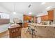Spacious kitchen boasts granite countertops, travertine floors, and modern appliances at 615 Maple Forest Dr, Orlando, FL 32825