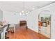 Open concept living area and kitchen featuring beautiful hardwood flooring and plenty of light at 615 Maple Forest Dr, Orlando, FL 32825