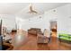 Spacious living room features wood floors, a ceiling fan, and comfortable seating at 615 Maple Forest Dr, Orlando, FL 32825