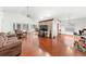 Inviting living room featuring hardwood flooring and a decorative stone wall at 615 Maple Forest Dr, Orlando, FL 32825