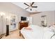 Serene bedroom featuring tile floors, a ceiling fan, and a door to the backyard at 615 Maple Forest Dr, Orlando, FL 32825
