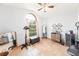 Well-lit room with a large window, tile floors, and a ceiling fan at 615 Maple Forest Dr, Orlando, FL 32825