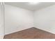 Empty bedroom with hardwood floors, closet, and neutral decor at 7863 Sugar Bend Dr # 7863, Orlando, FL 32819