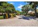 Entrance to the Sanctuary at Bay Hill community, showcasing the manicured grounds at 7863 Sugar Bend Dr # 7863, Orlando, FL 32819