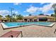 Community pool with lounge chairs and a clubhouse, perfect for relaxation and recreation at 7863 Sugar Bend Dr # 7863, Orlando, FL 32819
